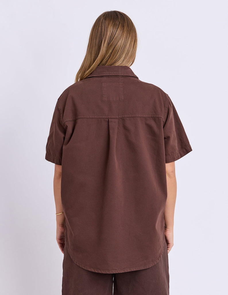 Daisy Short Sleeve Shirt - Chocolate-Foxwood-Your favourite denim shirt just got cooler with short sleeves. Featuring a button-through placket, front chest pockets, and a relaxed fit, the Daisy SS Shirt is perfect for easygoing days with laid-back style. Button through placket Front chest pockets Relaxed fit Model is wearing a size 10-Pash + Evolve