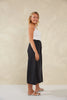Dalton Denim Skirt - Slate-HAVEN-Meet your new go-to denim piece, the Dalton Denim Skirt, crafted from stretchy cotton. This midi skirt, flaunting an A-line silhouette, seamlessly incorporates features from your favourite denim jeans. An ideal alternative to traditional jeans, it's the perfect companion for casual occasions and weekend activities. A-Line Mid-rise Half elastic waist Button and zip closure Belt loops Front and back pockets Wide vents Midi-length 98% Cotton, 2% Spandex-Pash + Evolve