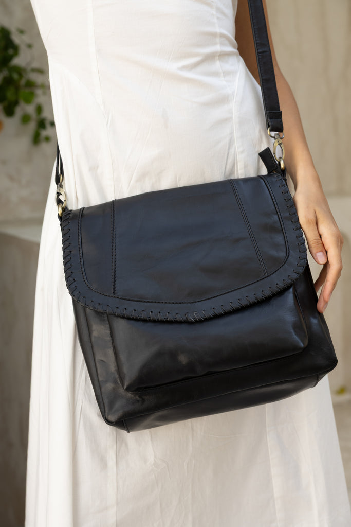 Darcy bag - Black-Baleka Leather-Your perfect everyday companion! With a spacious silhouette that doesn’t compromise on style. This bag features a secure zip closure, a handy back zip pocket and a front pocket for quick access to your essentials. Inside you will find a zip pocket and an additional internal pocket, all beautifully lined to keep your items organized and protected. The adjustable strap ensures a comfortable fit, whether worn on the shoulder or crossbody. The Darcy is your new go to - refined, 