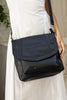 Darcy bag - Black-Baleka Leather-Your perfect everyday companion! With a spacious silhouette that doesn’t compromise on style. This bag features a secure zip closure, a handy back zip pocket and a front pocket for quick access to your essentials. Inside you will find a zip pocket and an additional internal pocket, all beautifully lined to keep your items organized and protected. The adjustable strap ensures a comfortable fit, whether worn on the shoulder or crossbody. The Darcy is your new go to - refined, 