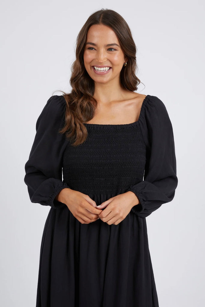 Dusk Midi Dress - Black-Elm-Pretty And Perfect The Dusk Midi Dress Is Stylish Simplicity. Featuring 3/4 Length Puff Sleeves, A Flattering Shirred Bodice And It Even Has Pockets! Dress Her Up Or Down The Dusk Midi Is The Versatile Style You Need This Season. Best Selling Style Shirred Bodice Slightly Puffed Elasticated Sleeves Slub Tencel Model is 171cm and wears Size 10-Pash + Evolve