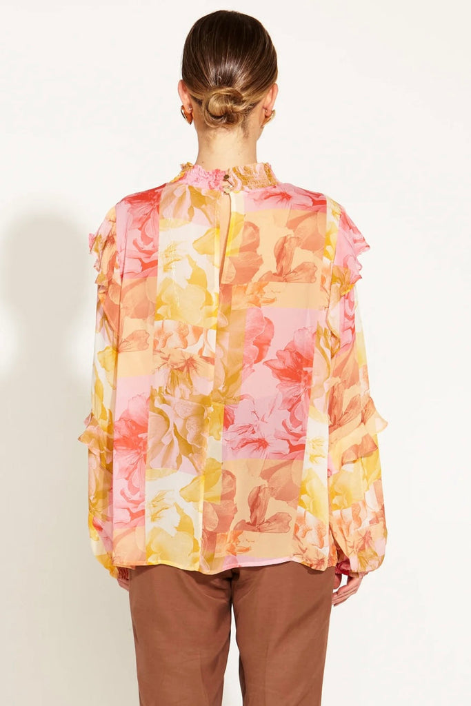 Earthly Paradise Long Sleeve Frill Detail Sheer Blouse - Paradise Floral-FATE + BECKER-Indulge in the ethereal charm of our Earthly Paradise Long Sleeve Sheer Blouse. This wearable masterpiece effortlessly blends comfort with couture, offering a whisper of sophistication with every sheer detail. Elevate your style with the essence of an earthly paradise, where each wear is a journey into refined elegance. -Regular Fit-Frill Detail on Sleeves-Long Sleeve Fabric and CareMain - 100% Viscose / Lining - 95% Visc