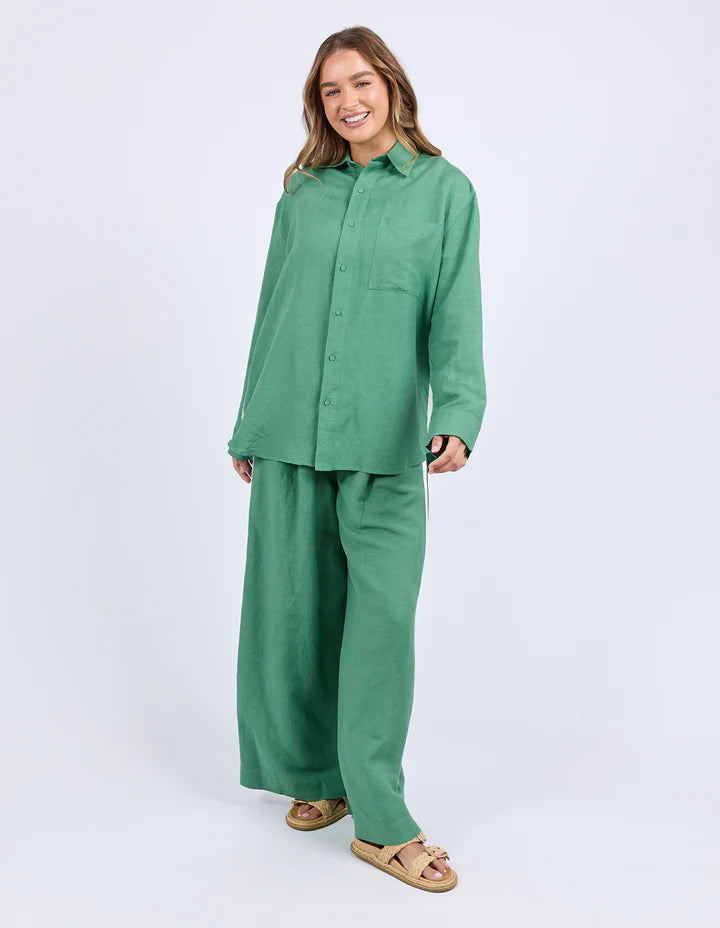 Elemental Shirt - Green-Foxwood-The Elemental Shirt blends laid-back style with a sporty edge. Made from a breathable linen blend, it features classic buttons and collar, a handy chest pocket, and sleek side tape details for a modern twist. Easy to wear and made to move with you. Side tape detail Front pocket placket opening Chest pocket 55% Linen, 45% Viscose Model is wearing a size 10-Pash + Evolve