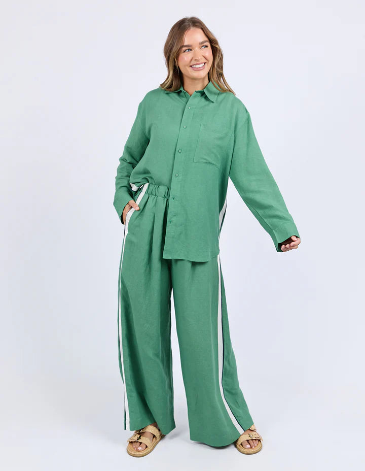 Elemental Shirt - Green-Foxwood-The Elemental Shirt blends laid-back style with a sporty edge. Made from a breathable linen blend, it features classic buttons and collar, a handy chest pocket, and sleek side tape details for a modern twist. Easy to wear and made to move with you. Side tape detail Front pocket placket opening Chest pocket 55% Linen, 45% Viscose Model is wearing a size 10-Pash + Evolve