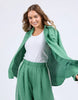 Elemental Shirt - Green-Foxwood-The Elemental Shirt blends laid-back style with a sporty edge. Made from a breathable linen blend, it features classic buttons and collar, a handy chest pocket, and sleek side tape details for a modern twist. Easy to wear and made to move with you. Side tape detail Front pocket placket opening Chest pocket 55% Linen, 45% Viscose Model is wearing a size 10-Pash + Evolve