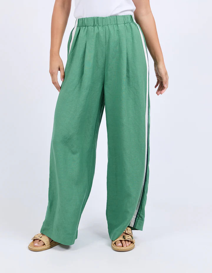 Elemental pant - green-Foxwood-Move with ease in the Elemental Pant. Featuring sleek side tape details, an elastic waist for all-day comfort, handy side pockets, and a wide leg silhouette, these linen blend pants bring sporty style and effortless cool to your everyday look. Side tape detail Elastic waist Side pockets 55% Linen, 45% Viscose Model is wearing a size 10-Pash + Evolve