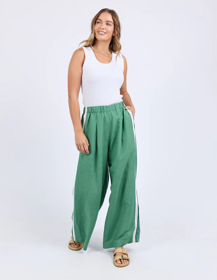Elemental pant - green-Foxwood-Move with ease in the Elemental Pant. Featuring sleek side tape details, an elastic waist for all-day comfort, handy side pockets, and a wide leg silhouette, these linen blend pants bring sporty style and effortless cool to your everyday look. Side tape detail Elastic waist Side pockets 55% Linen, 45% Viscose Model is wearing a size 10-Pash + Evolve