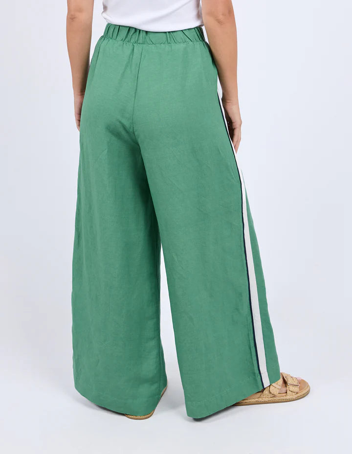 Elemental pant - green-Foxwood-Move with ease in the Elemental Pant. Featuring sleek side tape details, an elastic waist for all-day comfort, handy side pockets, and a wide leg silhouette, these linen blend pants bring sporty style and effortless cool to your everyday look. Side tape detail Elastic waist Side pockets 55% Linen, 45% Viscose Model is wearing a size 10-Pash + Evolve
