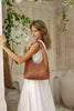 Elle shoulder bag - Vintage tan-Baleka Leather-Timelessly stylish, Elle is your go to for days that flow from brunch to evening drinks with the girls. With a sleek, minimal silhouette that fits comfortably under the arm, it's the perfect blend of style and ease. Featuring a secure button closure, internal zip, slip pocket and a fully lined interior, the Elle bag carries your essentials with refined simplicity. Understated, modern and ready for wherever the day takes you! A stylish bag designed in the beaut