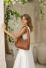 Elle shoulder bag - Vintage tan-Baleka Leather-Timelessly stylish, Elle is your go to for days that flow from brunch to evening drinks with the girls. With a sleek, minimal silhouette that fits comfortably under the arm, it's the perfect blend of style and ease. Featuring a secure button closure, internal zip, slip pocket and a fully lined interior, the Elle bag carries your essentials with refined simplicity. Understated, modern and ready for wherever the day takes you! A stylish bag designed in the beaut
