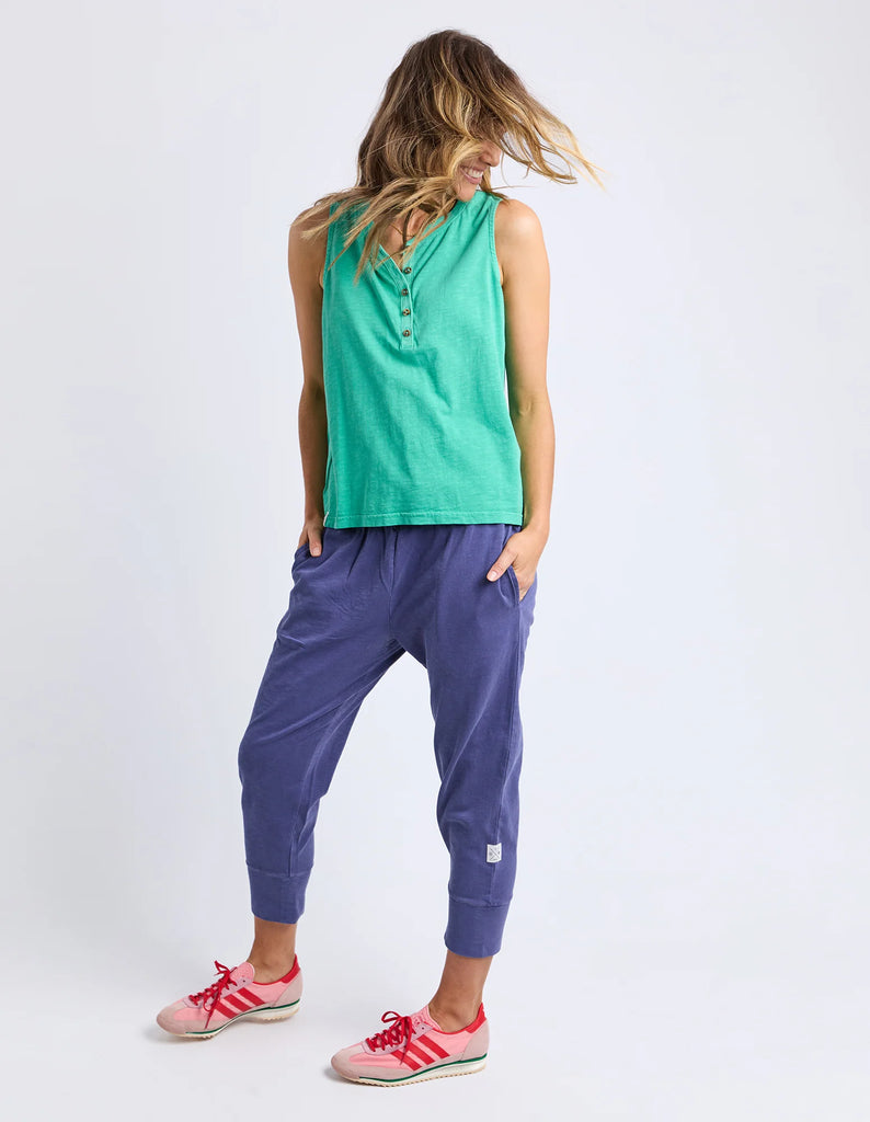 Elysian tank - gumdrop green-Elm-The Elysian Tank features a sleek button placket on the front for adjustable styling and added detail. Woven tape along the side seams enhances the tank's structure, creating a polished look while maintaining comfort. This versatile piece effortlessly elevates casual and layered outfits alike. Button placket Wide straps for bra coverage Woven tape down side seams 100% Cotton Slub Jersey Model is 171cm and wears Size 10-Pash + Evolve