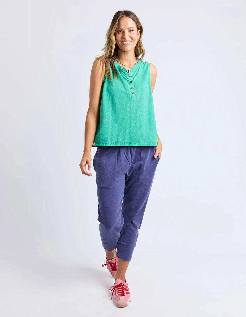 Elysian tank - gumdrop green-Elm-The Elysian Tank features a sleek button placket on the front for adjustable styling and added detail. Woven tape along the side seams enhances the tank's structure, creating a polished look while maintaining comfort. This versatile piece effortlessly elevates casual and layered outfits alike. Button placket Wide straps for bra coverage Woven tape down side seams 100% Cotton Slub Jersey Model is 171cm and wears Size 10-Pash + Evolve