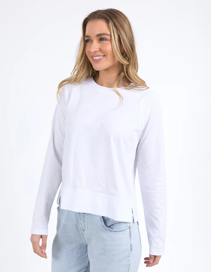 Endless Long Sleeve Tee - White-Foxwood-The Endless Long Sleeve features a classic design with a side split hem and lightweight feel. Its crew neck and clean finish make it a comfortable choice for everyday wear. Round neckline Raglan sleeve Side seam splits 100% Cotton Our model is 176cm and wears Size 10-Pash + Evolve
