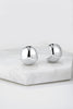 Erin earring - silver-Zafino-The Erin Hoop is a medium-sized ball-style hoop that strikes the perfect balance between everyday wear and bold statement. With its on-trend design and polished finish, this piece adds a modern edge to any look. Lightweight and stylish, the Erin Hoop is your new go-to for effortless cool. Metal: Silver Rhodium Plated on Brass Dimensions: 17mm (W) x 20mm (L) Water Resistant: Splash proof, not recommended to be worn in the ocean or pool-Pash + Evolve