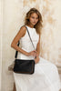 Esme bag - Black/tan trim-Baleka Leather-With its seamless silhouette and elevated simplicity, Esme is designed to keep up with your pace - from morning meetings to evening plans. A contrast trim adds subtle detail, while the adjustable strap allows for easy wear - over the shoulder or crossbody. Thoughtfully finished with a fully lined interior, internal zip and slip pocket, keeping your essentials organised. The perfect, modern style for everyday use. A modern style designed in the beautiful town of Port