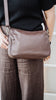 Esme bag - Chocolate Pebble-Baleka Leather-With its seamless silhouette and elevated simplicity, Esme is designed to keep up with your pace - from morning meetings to evening plans. The Pebble leather adds subtle detail, while the adjustable strap allows for easy wear - over the shoulder or crossbody. Thoughtfully finished with a fully lined interior, internal zip and slip pocket, keeping your essentials organised. The perfect, modern style for everyday use. A modern style designed in the beautiful town of 