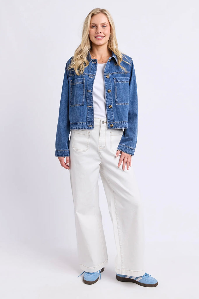 Essie Denim Jacket - Mid Blue Wash-Elm-The Essie Denim Jacket is a fresh take on a classic layer. Designed with a cropped length, relaxed fit and chest patch pockets, it adds just the right amount of structure to everyday outfits. Throw it over a tee dress, pair it with wide-leg pants or wear it with contrasting denim for an easy double-denim moment. Chest patch pockets Cropped length Rigid denim Relaxed fit 100% cotton denim The Model is 173cm and is wearing a size 10-Pash + Evolve