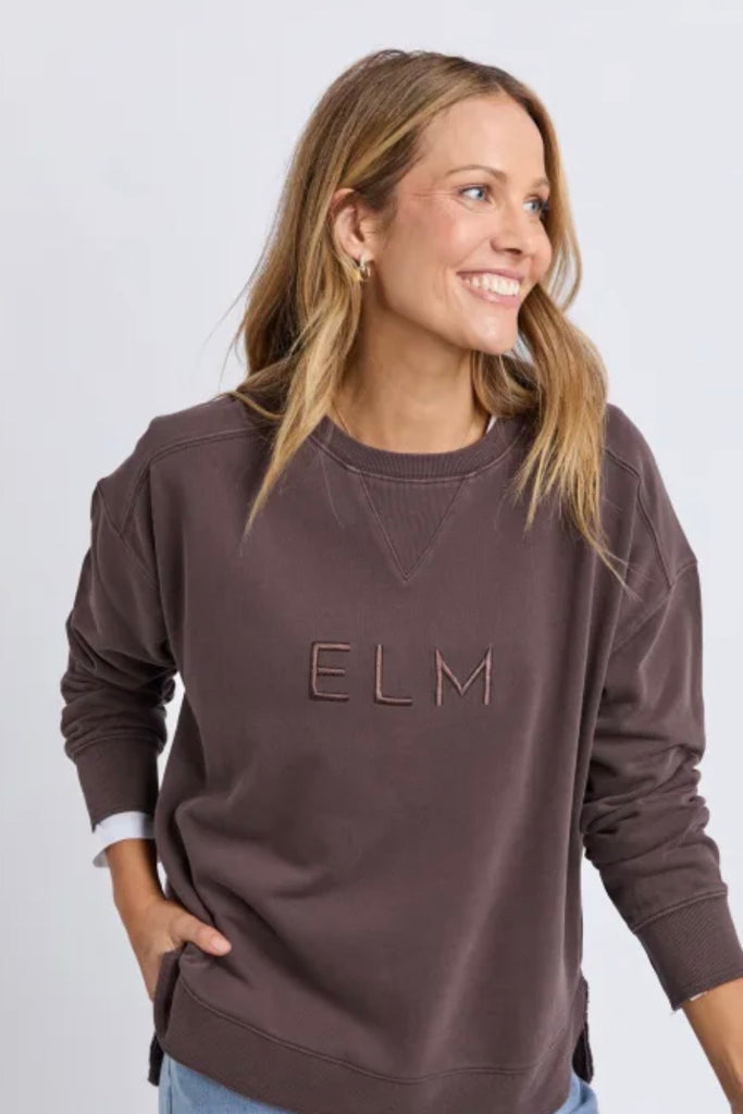 Established crew - coffee-Elm-Guaranteed to be your new favourite crew. The Established Crew features raw seam detail and cute Elm embroidery making it an effortless choice for both comfort and style. Raw hem detail Chest embroidery Scooped hemline Relaxed fit 100% cotton unbrushed fleece Model is wearing a size 10-Pash + Evolve