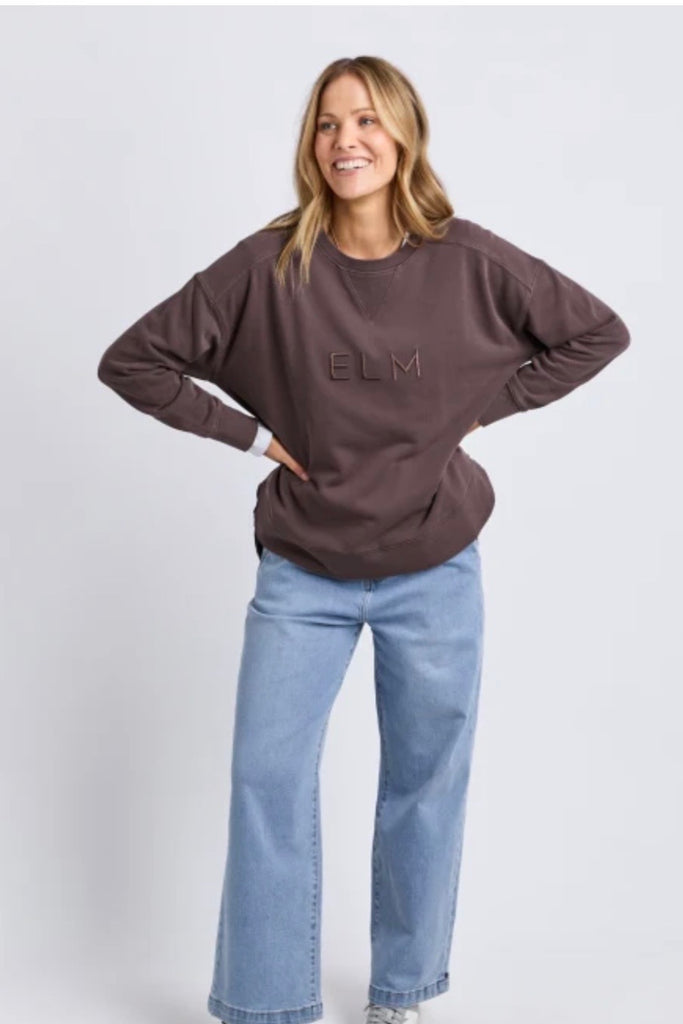 Established crew - coffee-Elm-Guaranteed to be your new favourite crew. The Established Crew features raw seam detail and cute Elm embroidery making it an effortless choice for both comfort and style. Raw hem detail Chest embroidery Scooped hemline Relaxed fit 100% cotton unbrushed fleece Model is wearing a size 10-Pash + Evolve