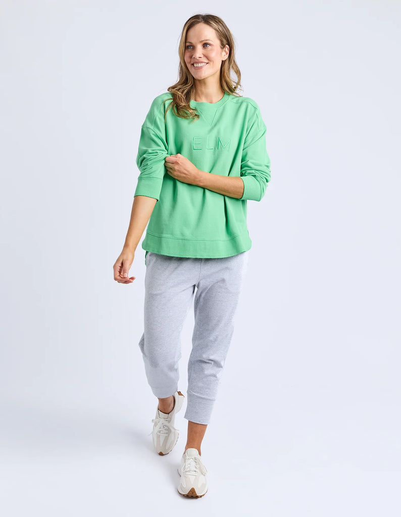 Established crew - spring green-Elm-Guaranteed to be your new favourite crew. The Established Crew features raw seam detail and cute Elm embroidery making it an effortless choice for both comfort and style. Raw Seams Elm Embroidery Crew Neckline Unbrushed Cotton Fleece 100% Cotton Model is wearing a size 10-Pash + Evolve