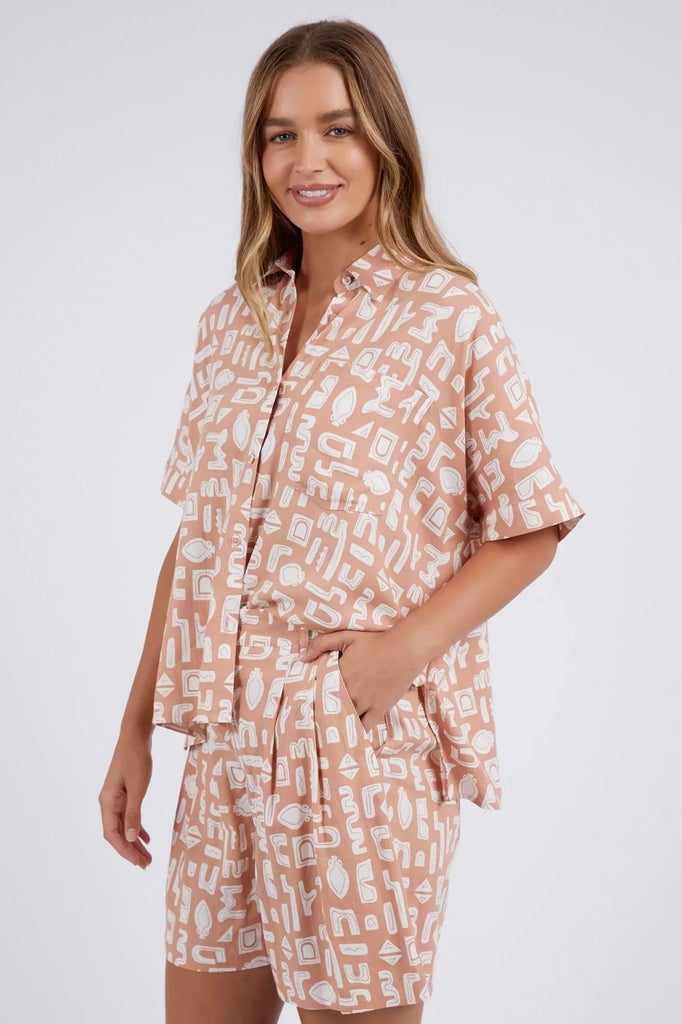 Etched Geo Shirt - geo clay-Foxwood-An exclusive new print for the season. Geometric holiday-style prints are everything! This classic linen blend shirt has a flattering boxy cut that looks just as great worn open atop your shorts as it does buttoned up and tucked in to your favourite pants. Match back with the Etched Geo Pant or Shorts for the ultimate in vacay-style twin set dressing. Foxwood Exclusive Print Button through Placket Front Chest Pocket Linen Viscose Model is wearing a Size 10-Pash + Evolve