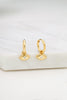Evil eye earring - gold-Zafino-The Evil Eye Earring is a huggie hoop featuring a delicate evil eye drop, symbolising protection and positivity. Designed for effortless everyday wear, this meaningful piece adds a subtle yet stylish touch to any look. 18K Gold Plated Solid Brass Base 8mm (w) x 16mm (L) Splash Proof: Splashes or occasional water contact-Pash + Evolve