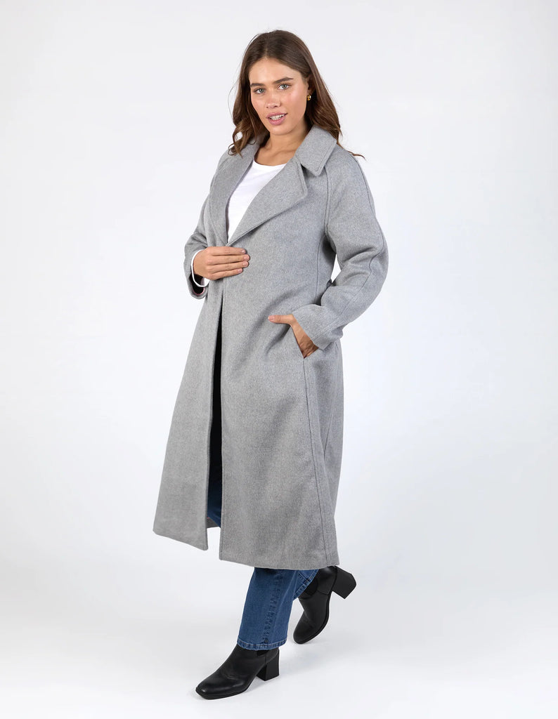 Farrah coat - grey marle-Elm-A coat for the ages. This gorgeous wool melton blend coat features a endlessly flattering long line shape with button openings and lapel collar. The jacket has pockets and is not lined making it versatile for all weather. Long line shape Button opening with pockets No lining 90% Polyester, 10% Wool Model is wearing a size 10-Pash + Evolve