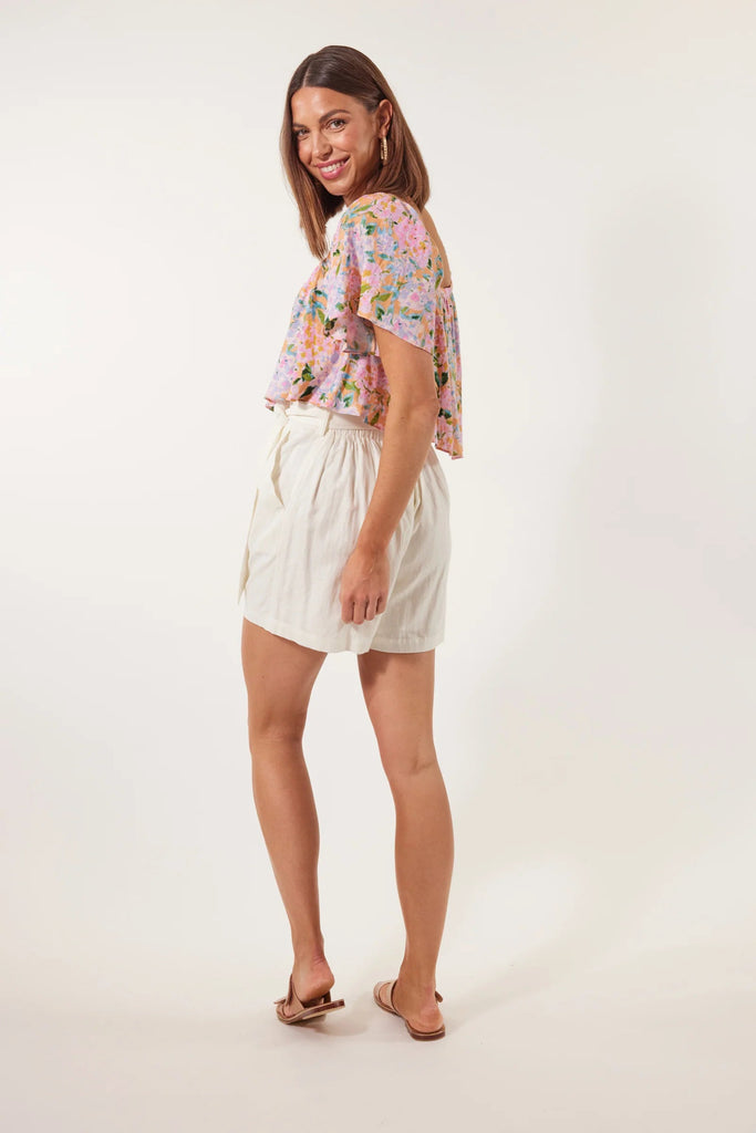 Flora Short - Lotus-Isle of Mine-Meet the Flora Short: the epitome of elegance and ease. These sophisticated linen blend shorts exude smart simplicity, making them a go-to choice for leisurely weekends. The high-waisted design and self-tie belt effortlessly flatter your curves, and when paired with a chic blouse and strappy sandals, make an effortlessly cool lunch ensemble. FEATURES: High-waist Half-elastic waist Self-fabric belt Belt loops Slash pockets Plain Material: 63% Viscose, 37% Linen Print Material