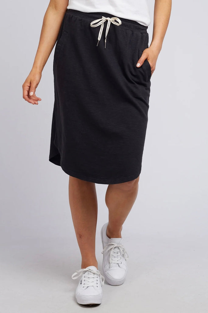 Fundamental Isla Skirt - Washed Black-Elm-Stylish And Versatile Skirt Ideal For Everyday Spring & Summer Wear. Featuring An Elasticated Tie Waist, Pockets And A Below Knee Scooped Hemline, The Isla Skirt Is Ideal For Everyone's Wardrobe. Versatile Everyday Skirt Elasticated Tie Waist Scooped Hemline Cotton Jersey Model is 169cm and wears Size 10-Pash + Evolve