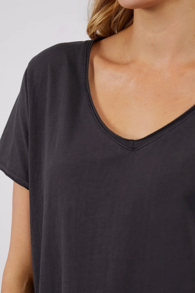 Fundamental Vee Tee - Washed Black-Elm-The Fundamental Vee Tee Is Made From Cotton Jersey And Has Raw Edges Around The Neckline And Sleeve Openings With A Design Feature Seam On The Back Body. It Is A Must-Have Item In Your Wardrobe, Your Go-To Basic Tee. Everyone's Favourite Tee Raw Edge Detail on Neckline & Sleeve Vee Neckline 100% Cotton Model is 169cm and wears Size 10-Pash + Evolve