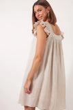 Gala Dress - Canvas-Isle of Mine-Exude grace and confidence with the elegant Gala Dress, made from an airy Ramie fabric. Delicate embroidery adorns the square neckline, complemented by charming frill sleeves and a relaxed hem. Transition seamlessly from day to night by pairing it with sneakers or strappy sandals. FEATURES: Square neck with embroidered detail and gathering Short frill sleeves Inseam pockets Knee-length Relaxed hem Lotus, Peony & Teal: 100% Ramie Canvas: 52% Linen, 48% Ramie Lining: 100% Rayo
