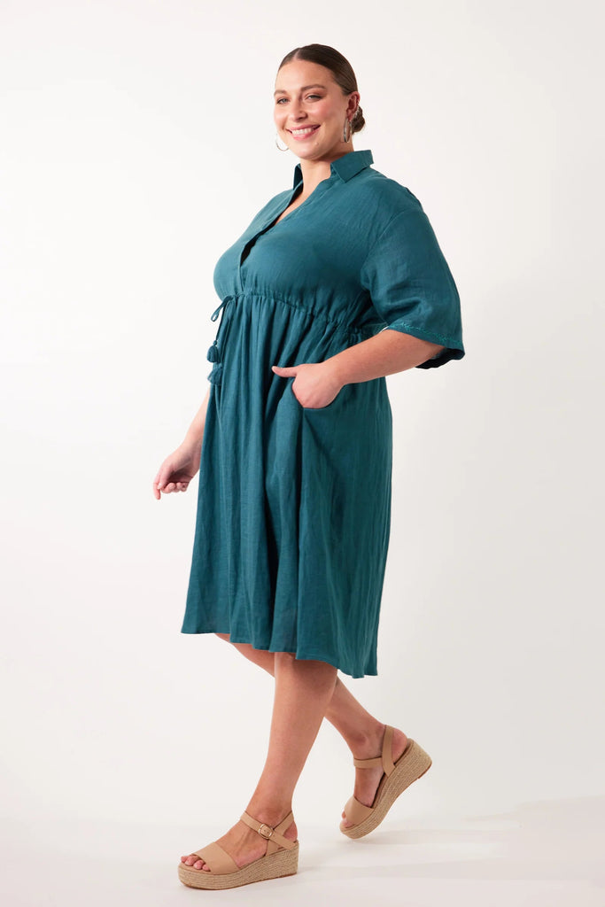 Gala Relax Dress - Teal-Isle of Mine-Whether you're looking to keep it casual or dress it up, the Gala Relax Dress will have you feeling fabulous all season long. Crafted from breathable Ramie fabric, it offers comfort in a flattering one-size fit that you can effortlessly transition from a laid-back day out to an elegant evening affair. Pair it with a sunhat and sneakers for a picnic in the park, or accessorise it with heels and statement jewellery for a glam night out. FEATURES: Collar with half-button de