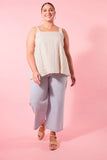 Gala Tank - Canvas-Isle of Mine-The Gala Tank is the epitome of summer comfort and style. Crafted with luxurious Ramie fabric, it offers a relaxed and refreshing feel. The square neck and adjustable shoulder straps provide a flattering fit, while embroidered detailing adds an elegant touch. Pair it with loose pants or shorts for a laid-back weekend look. FEATURES: Square neck Adjustable shoulder straps with embroidered detail Ruched detail on the back Relaxed hem Lotus, Peony & Teal: 100% Ramie Canvas: 52% 