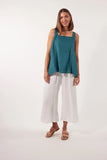 Gala Tank - Teal-Isle of Mine-The Gala Tank is the epitome of summer comfort and style. Crafted with luxurious Ramie fabric, it offers a relaxed and refreshing feel. The square neck and adjustable shoulder straps provide a flattering fit, while embroidered detailing adds an elegant touch. Pair it with loose pants or shorts for a laid-back weekend look. FEATURES: Square neck Adjustable shoulder straps with embroidered detail Ruched detail on the back Relaxed hem Lotus, Peony & Teal: 100% Ramie Canvas: 52% Li