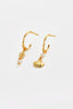 Goldie Hoop - Gold-Zarla-A refined hoop finished with delicate charms and soft pearl accents. Light-catching and fluid, it brings a warm, sunlit feel with a subtle coastal edge. Effortless, feminine, and designed for everyday wear. *18K Gold Plated Solid Brass Base *Water proof: Can be worn in the ocean or pool-Pash + Evolve