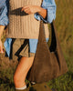 Hailey Suedette Shoulder Bag - Olive Brown-Louenhide-The Hailey Olive Suedette Shoulder Bag brings all the soft, easy charm your weekend plans deserve, crafted from rich faux suede for a luxe, textured feel. Her gently slouchy silhouette and studded shoulder strap add a hint of edge to an otherwise understated design, giving her the refined attitude of a studded hobo bag. A magnetic clasp closure keeps your essentials secure yet effortlessly accessible. Whether you’re heading to a long lunch, wandering a w
