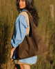 Hailey Suedette Shoulder Bag - Olive Brown-Louenhide-The Hailey Olive Suedette Shoulder Bag brings all the soft, easy charm your weekend plans deserve, crafted from rich faux suede for a luxe, textured feel. Her gently slouchy silhouette and studded shoulder strap add a hint of edge to an otherwise understated design, giving her the refined attitude of a studded hobo bag. A magnetic clasp closure keeps your essentials secure yet effortlessly accessible. Whether you’re heading to a long lunch, wandering a w