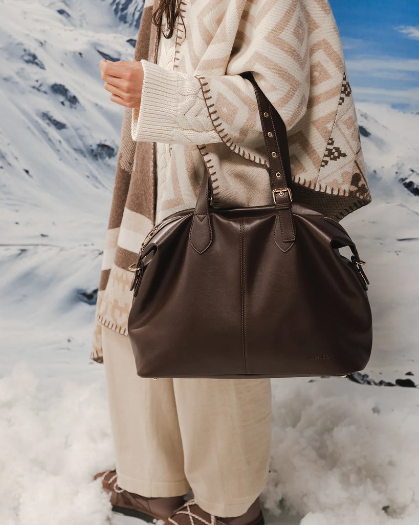 Hampton Tote Bag - Chocolate-Louenhide-The Hampton Chocolate Tote Bag is designed for departures both planned and unexpected. With a silhouette that balances structure and softness, she brings a refined presence to moments in motion, from weekend escapes to daily commutes. Crafted in smooth vegan leather, Hampton Chocolate features dual top handles and a detachable strap, offering a versatile, considered way to carry. Understated in finish, she redefines the carry-on tote bag with trolley sleeve, moving eff