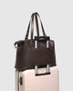 Hampton Tote Bag - Chocolate-Louenhide-The Hampton Chocolate Tote Bag is designed for departures both planned and unexpected. With a silhouette that balances structure and softness, she brings a refined presence to moments in motion, from weekend escapes to daily commutes. Crafted in smooth vegan leather, Hampton Chocolate features dual top handles and a detachable strap, offering a versatile, considered way to carry. Understated in finish, she redefines the carry-on tote bag with trolley sleeve, moving ef