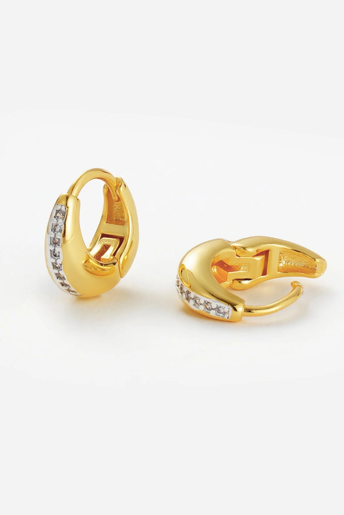 Hayley Huggie - Gold-Zafino-The Hayley Huggie combines a sleek gold silhouette with a line of sparkling crystals for effortless sophistication. Its curved design hugs the ear comfortably, making it the perfect everyday piece that transitions seamlessly from casual to occasion wear. Wear solo for a subtle shine or stack with other huggies and studs for a layered look.Designed for modern women who want effortless style, every day. Metal: 18K Gold Plated on BrassDimensions: 10mm HoopWater Resistant: Splash pro