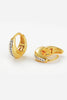Hayley Huggie - Gold-Zafino-The Hayley Huggie combines a sleek gold silhouette with a line of sparkling crystals for effortless sophistication. Its curved design hugs the ear comfortably, making it the perfect everyday piece that transitions seamlessly from casual to occasion wear. Wear solo for a subtle shine or stack with other huggies and studs for a layered look.Designed for modern women who want effortless style, every day. Metal: 18K Gold Plated on BrassDimensions: 10mm HoopWater Resistant: Splash pro