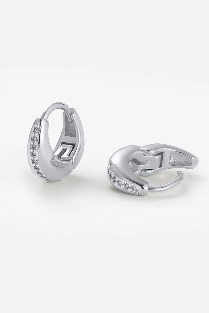 Hayley huggie - Silver-Zafino-The Hayley Huggie combines a sleek gold silhouette with a line of sparkling crystals for effortless sophistication. Its curved design hugs the ear comfortably, making it the perfect everyday piece that transitions seamlessly from casual to occasion wear. Wear solo for a subtle shine or stack with other huggies and studs for a layered look.Designed for modern women who want effortless style, every day. Metal: Silver Rhodium Plated on BrassDimensions: 10mm HoopWater Resistant: Sp