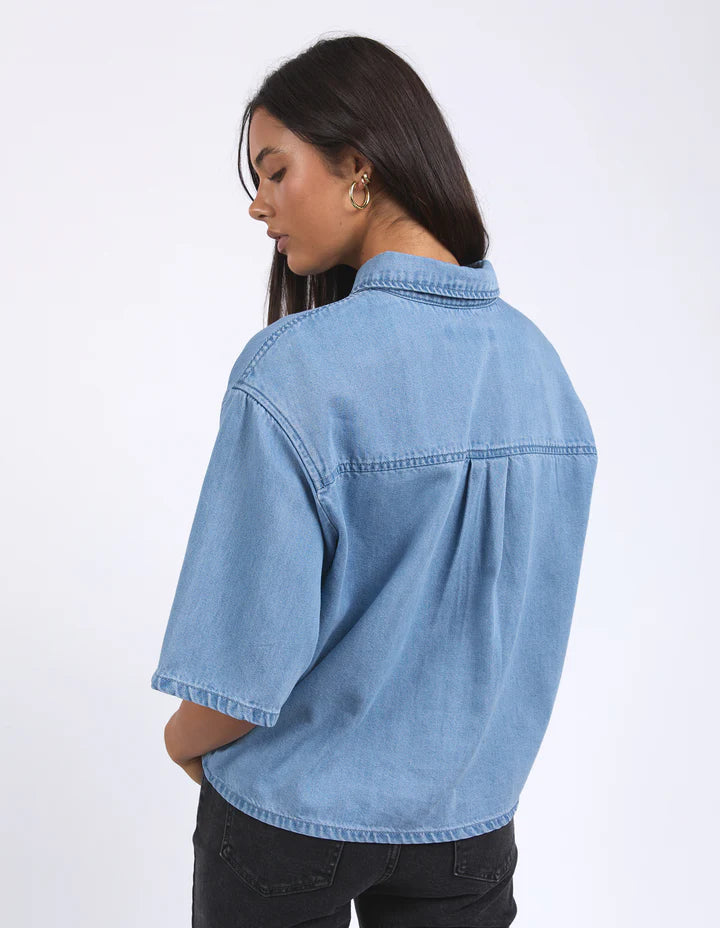 Hutton Denim Shirt - Light Blue-Foxwood-Effortlessly cool and versatile, this short-sleeve denim shirt is a wardrobe must-have. Made from 100% cotton, it offers a soft, breathable feel with a classic look. Featuring a front button opening and a relaxed fit, it’s perfect for layering or wearing on its own Front button opening Short sleeve Front chest pockets 100% Cotton-Pash + Evolve
