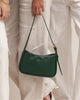 Ivy shoulder bag - forest green-Louenhide-The Louenhide Ivy Forest Green Shoulder Bag is a forever piece made to move with you. Designed to seamlessly transition from an elevated day look to the ideal night out companion, this petit shoulder bag is an essential addition to your capsule wardrobe. Created for the minimalist, this clean, seamless style effortlessly combines refinement with functionality. Secure your day-to-night essentials with the discreet top-zip closure, ensuring your belonging won’t fall o