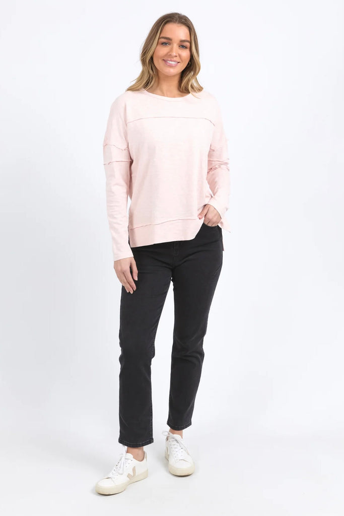 Jayne Throw On Top - Pale Pink-Foxwood-The Jayne Throw on Top is the perfect lightweight long sleeve to take you through the seasons. Cut from a comfy, cotton slub jersey this women's top features a crew neck, trendy exposed stitching and side split hi-low hem. Seriously versatile we know you'll be wearing this on repeat. Round neckline Design lines Raw edge details 100% Cotton Our model is 176cm and wears Size 10-Pash + Evolve