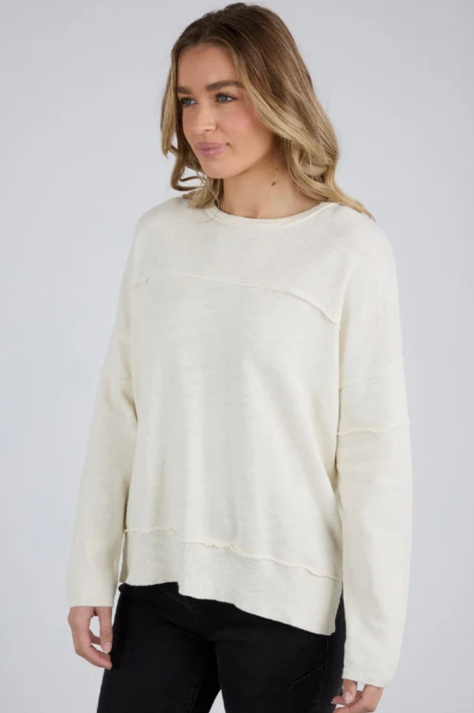 Jayne throw on knit - vintage white-Foxwood-Soft, breathable knit fabric Relaxed fit with raw seam details Ribbed cuffs, hemline, and neckline Subtle hi-low hemline Perfect for layering or standalone wear 100% Cotton-Pash + Evolve