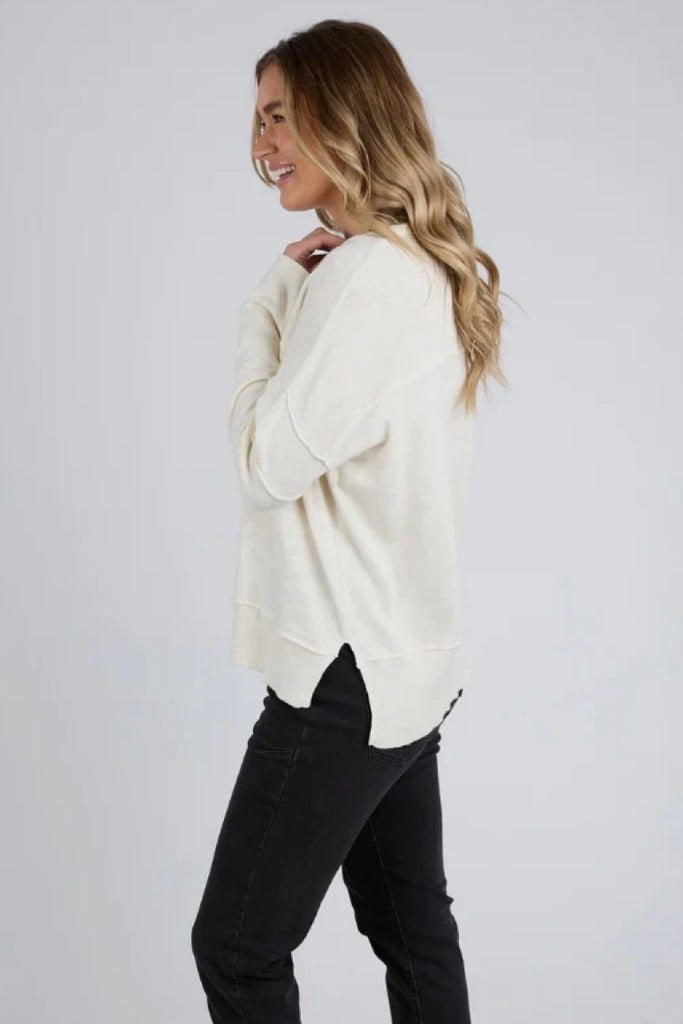 Jayne throw on knit - vintage white-Foxwood-Soft, breathable knit fabric Relaxed fit with raw seam details Ribbed cuffs, hemline, and neckline Subtle hi-low hemline Perfect for layering or standalone wear 100% Cotton-Pash + Evolve