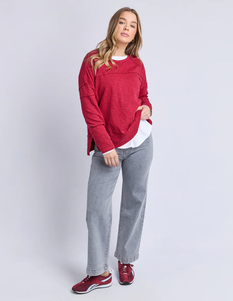 Jayne throw on top - Rhubarb red-Foxwood-The Jayne Throw on Top is the perfect lightweight long sleeve to take you through the seasons. Cut from a comfy, cotton slub jersey this women's top features a crew neck, trendy exposed stitching and side split hi-low hem. Seriously versatile we know you'll be wearing this on repeat. Round neckline Design lines Raw edge details 100% Cotton Model is wearing a size 10-Pash + Evolve