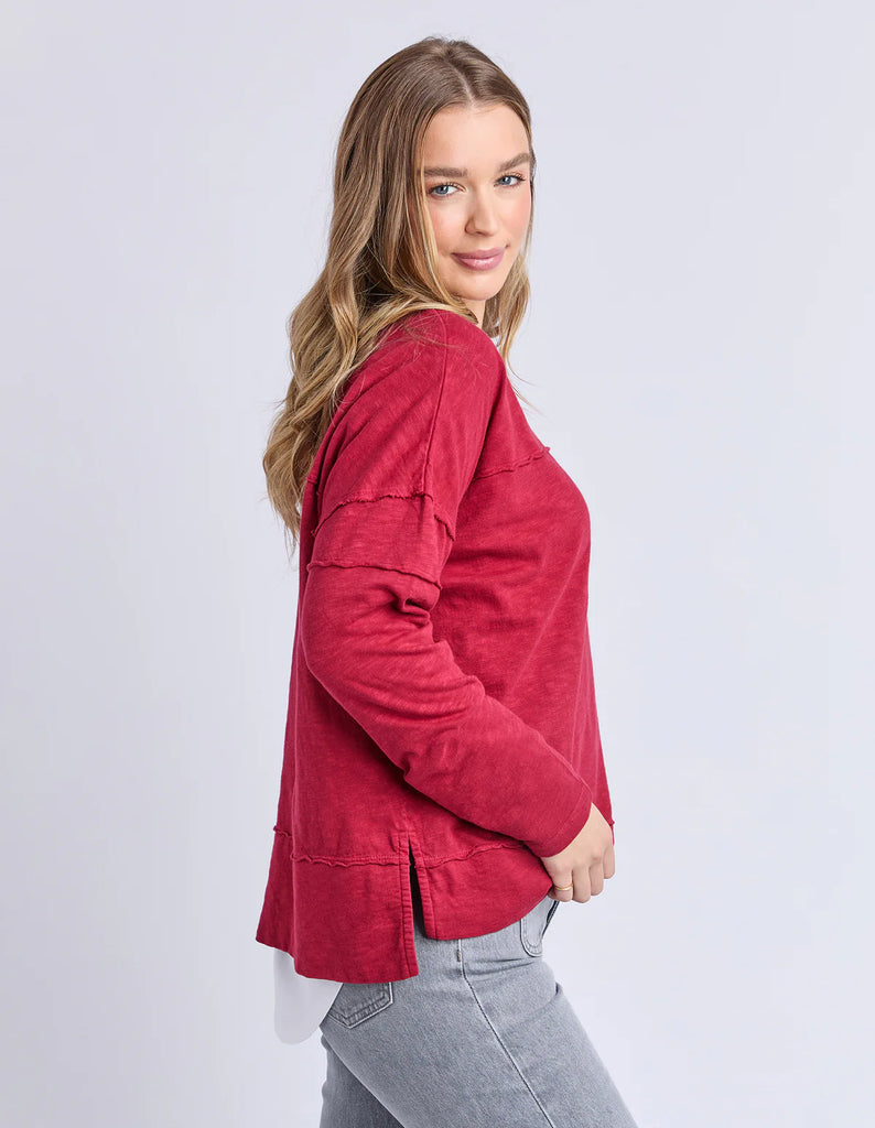 Jayne throw on top - Rhubarb red-Foxwood-The Jayne Throw on Top is the perfect lightweight long sleeve to take you through the seasons. Cut from a comfy, cotton slub jersey this women's top features a crew neck, trendy exposed stitching and side split hi-low hem. Seriously versatile we know you'll be wearing this on repeat. Round neckline Design lines Raw edge details 100% Cotton Model is wearing a size 10-Pash + Evolve