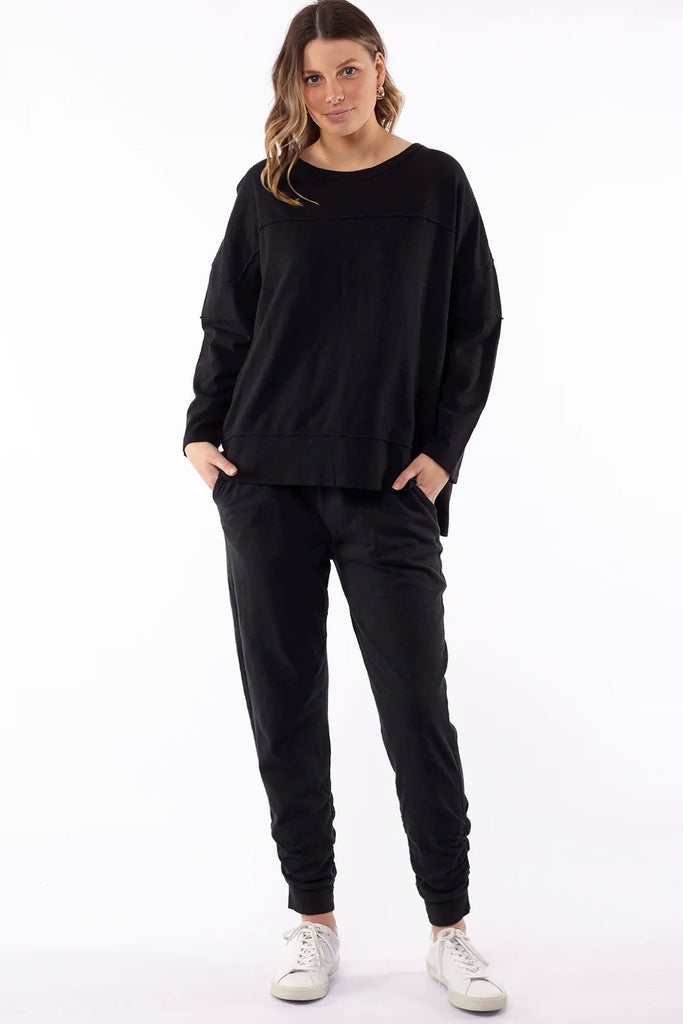 Jayne throw on top - black-Foxwood-The Jayne Throw on Top is the perfect lightweight long sleeve to take you through the seasons. Cut from a comfy, cotton slub jersey this women's top features a crew neck, trendy exposed stitching and side split hi-low hem. Seriously versatile we know you'll be wearing this on repeat. 100% COTTON JERSEY Designed in Australia-Pash + Evolve